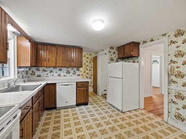 51 Quaboag Rd, Acton, MA 01720 - kitchen featuring white appliances, wallpapered walls, light countertops, light flooring, and a baseboard radiator
