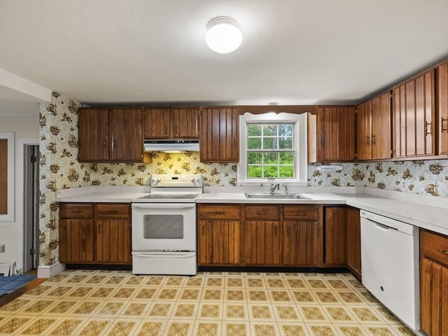 51 Quaboag Rd, Acton, MA 01720 - kitchen featuring white appliances, under cabinet range hood, light countertops, and wallpapered walls