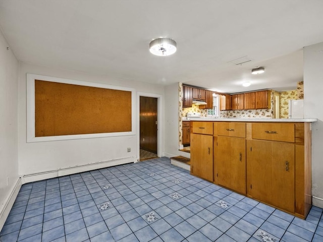 51 Quaboag Rd, Acton, MA 01720 - kitchen with baseboard heating, light countertops, and brown cabinetry