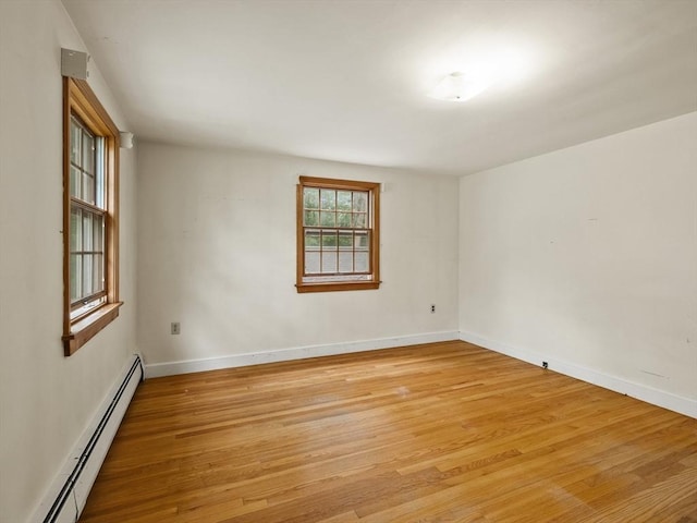 51 Quaboag Rd, Acton, MA 01720 - unfurnished room with baseboard heating and light wood-type flooring
