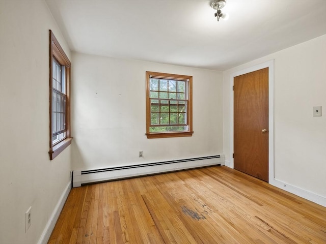 51 Quaboag Rd, Acton, MA 01720 - unfurnished room with baseboard heating and wood-type flooring