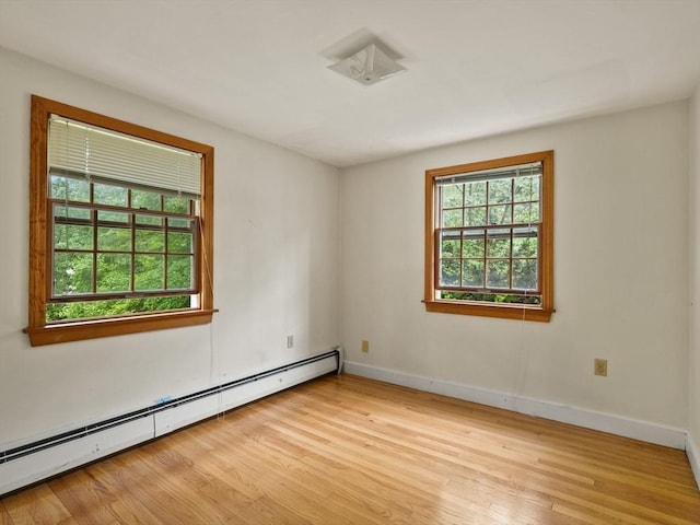 51 Quaboag Rd, Acton, MA 01720 - unfurnished room featuring a baseboard heating unit and light wood-type flooring