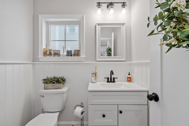 57 Railroad Ave Unit C1, Salisbury, MA 01952 - half bath with a wainscoted wall, vanity, and a decorative wall