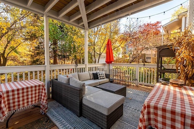 wooden terrace featuring outdoor lounge area