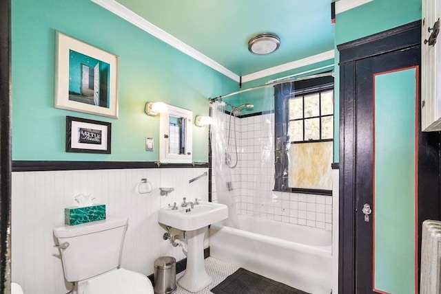 bathroom featuring tiled shower / bath combo, crown molding, radiator heating unit, and toilet