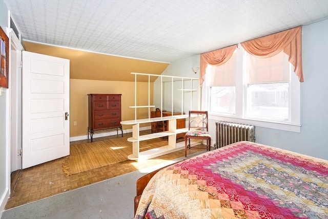 bedroom with parquet flooring and radiator