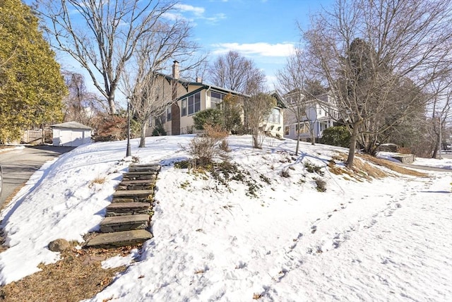 view of yard layered in snow