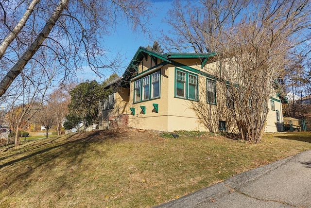 view of home's exterior featuring a lawn