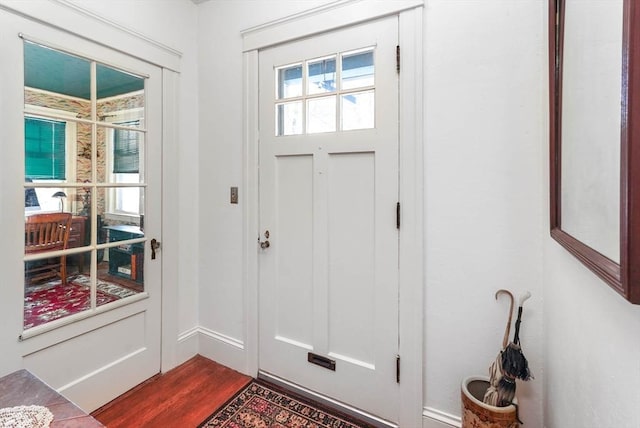 foyer with dark hardwood / wood-style flooring