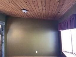 unfurnished room featuring wood ceiling