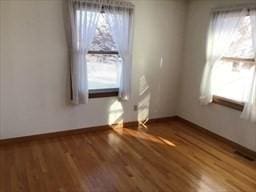 unfurnished dining area with wood finished floors