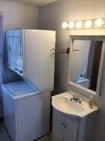 bathroom with washer / clothes dryer and vanity