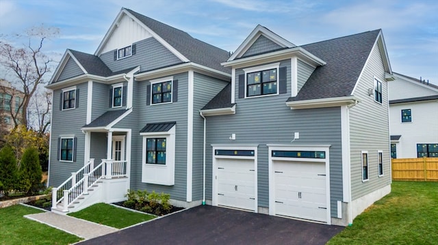 view of front of property featuring a front lawn and a garage