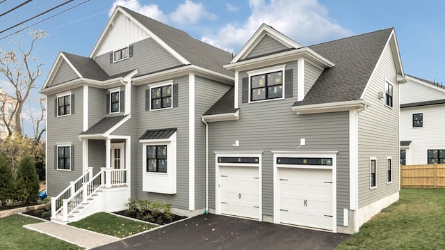 view of front of home with a garage and a front lawn