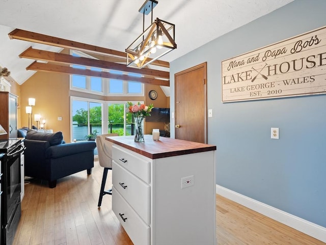11 Grove Point Rd, Wales, MA 01081 - kitchen featuring butcher block counters, white cabinetry, light wood finished floors, a center island, and black electric range