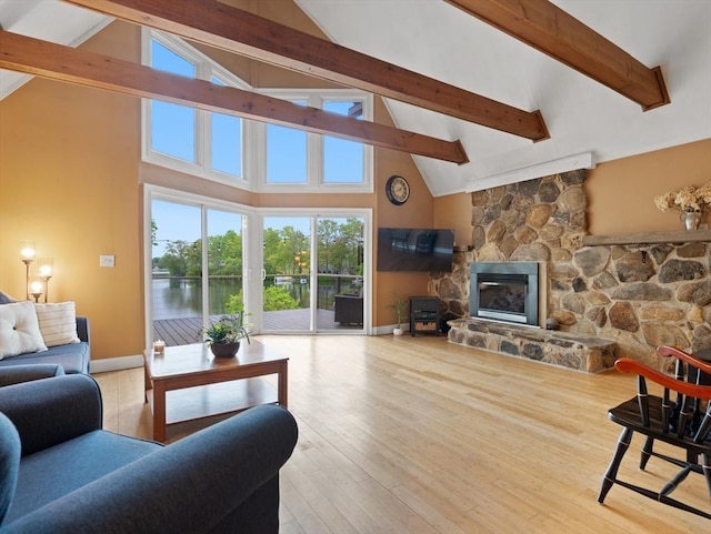 11 Grove Point Rd, Wales, MA 01081 - living room with beamed ceiling, high vaulted ceiling, wood finished floors, a fireplace, and baseboards