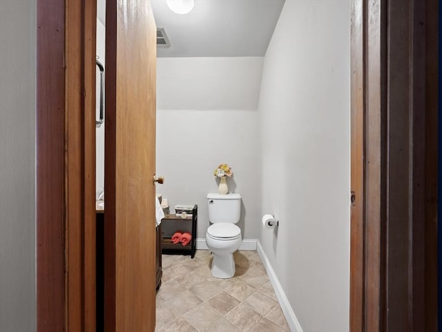 11 Grove Point Rd, Wales, MA 01081 - bathroom with toilet, tile patterned flooring, baseboards, and lofted ceiling