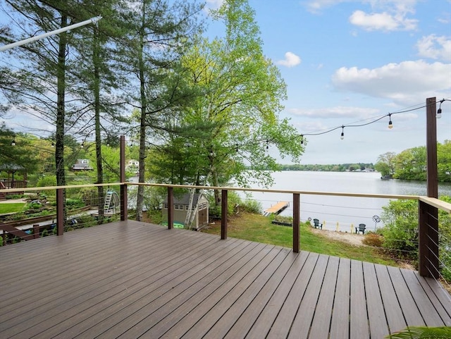 11 Grove Point Rd, Wales, MA 01081 - wooden deck featuring a water view, a storage unit, and an outbuilding