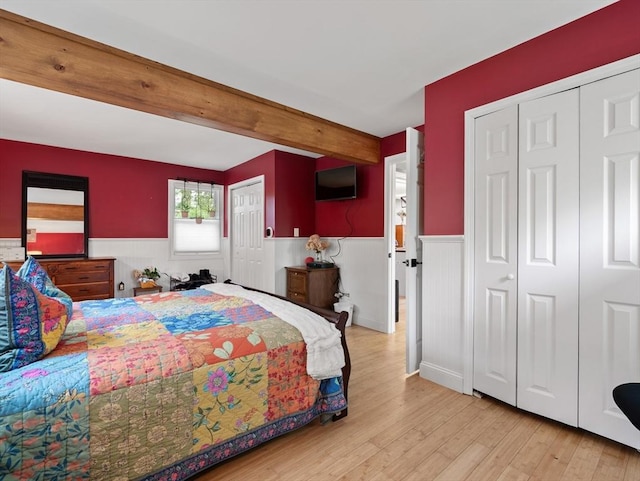 11 Grove Point Rd, Wales, MA 01081 - bedroom with a wainscoted wall, wood finished floors, beam ceiling, and a closet