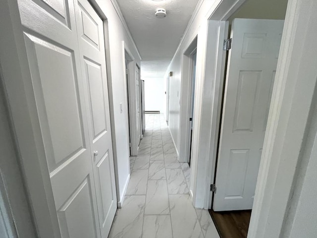 hall featuring marble finish floor