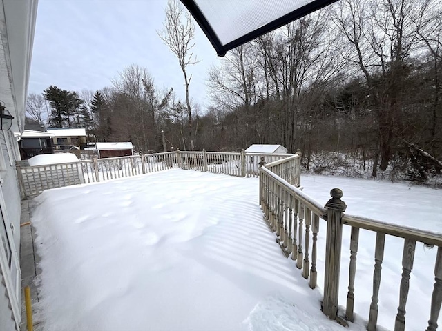 snowy yard with an outdoor structure