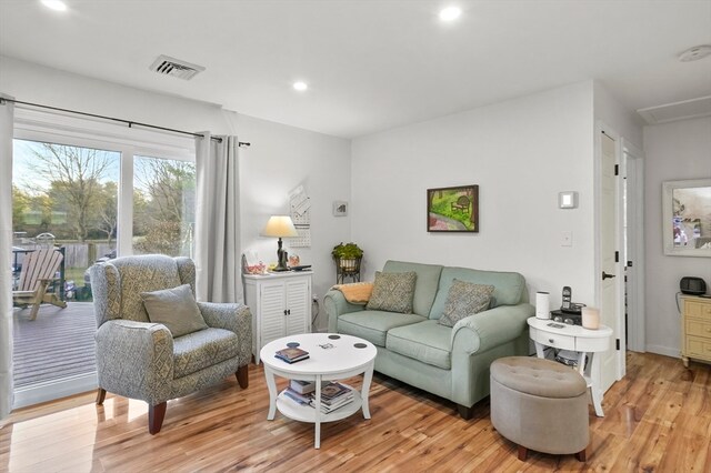 living room with light hardwood / wood-style flooring