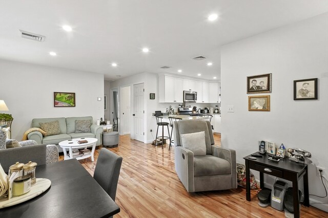 living room with light hardwood / wood-style floors