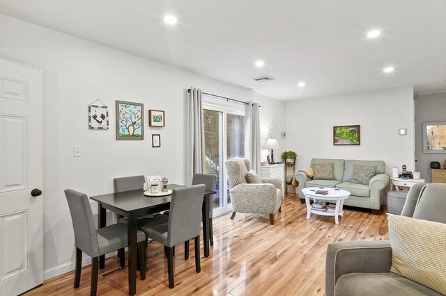 dining space with light hardwood / wood-style floors