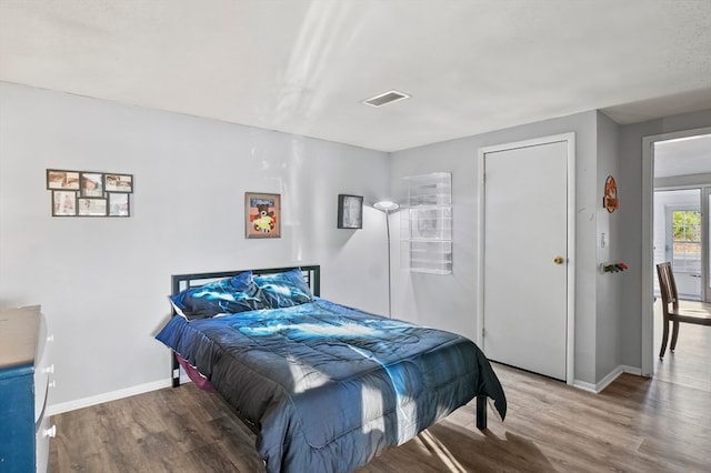 bedroom featuring wood-type flooring