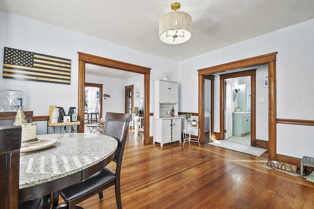 dining space with dark wood-type flooring