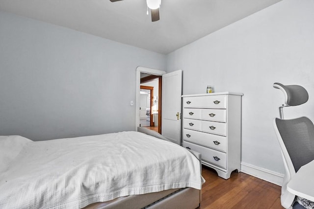 bedroom with ceiling fan and dark hardwood / wood-style floors