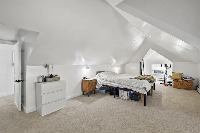 bedroom with light colored carpet and lofted ceiling