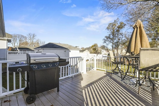 wooden deck with grilling area