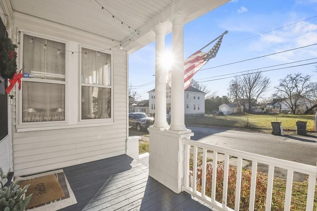 wooden deck featuring covered porch