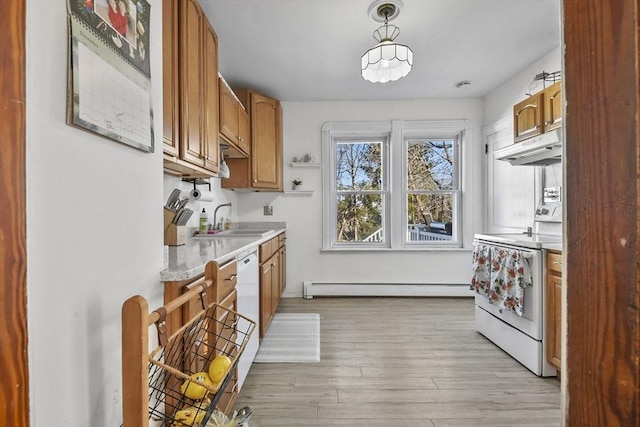 kitchen featuring sink, hanging light fixtures, light hardwood / wood-style flooring, a baseboard heating unit, and white appliances