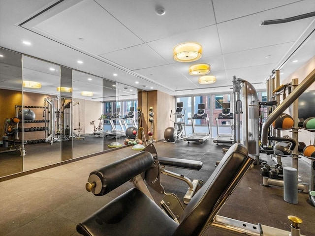 exercise room with a wealth of natural light and recessed lighting