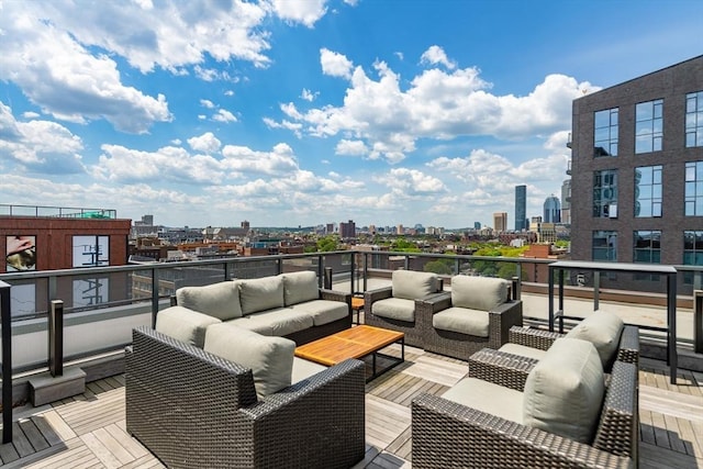 deck featuring a view of city and an outdoor living space