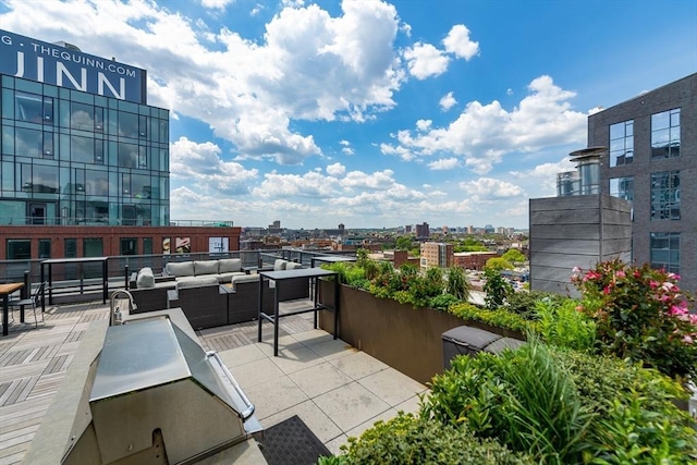 view of patio featuring an outdoor living space and a city view