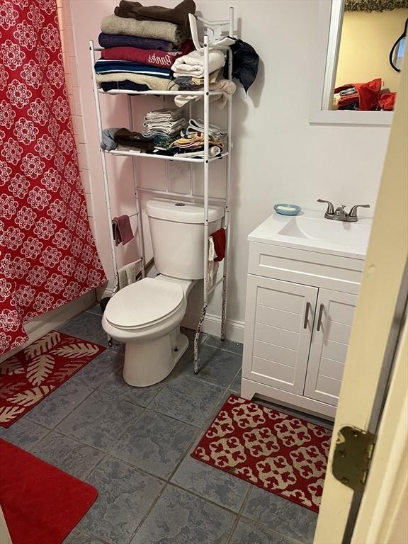 bathroom with toilet and vanity