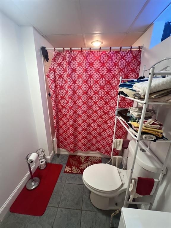 bathroom with toilet, tile patterned floors, and shower / bath combo