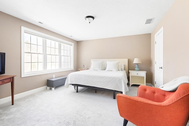 bedroom featuring baseboards, carpet floors, and visible vents