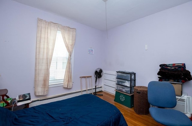 27 Stephen St, Lynn, MA 01902 - bedroom with baseboard heating, multiple windows, and wood finished floors
