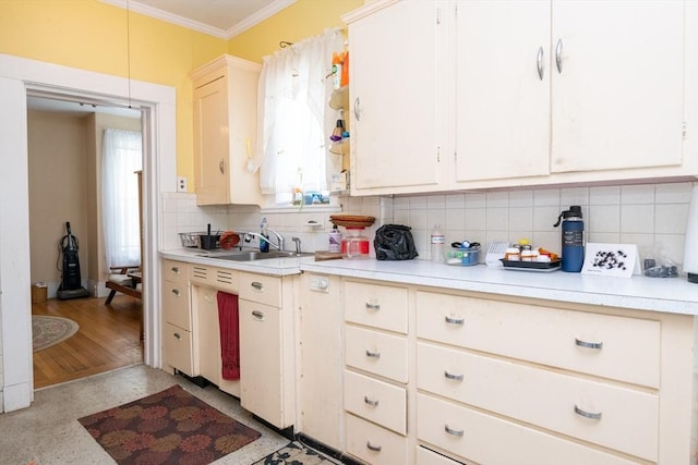 27 Stephen St, Lynn, MA 01902 - kitchen featuring light countertops, ornamental molding, tasteful backsplash, and a sink
