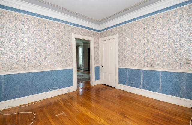 27 Stephen St, Lynn, MA 01902 - unfurnished room featuring hardwood / wood-style floors, wallpapered walls, crown molding, and baseboards