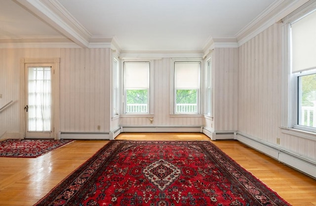27 Stephen St, Lynn, MA 01902 - spare room featuring crown molding, wood finished floors, and a baseboard radiator