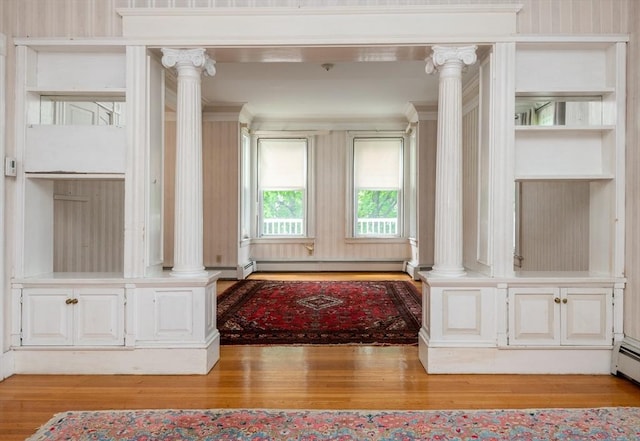 27 Stephen St, Lynn, MA 01902 - living room with ornate columns, wood finished floors, and baseboard heating