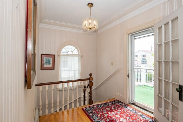 27 Stephen St, Lynn, MA 01902 - doorway to outside featuring ornamental molding, a chandelier, and wood finished floors