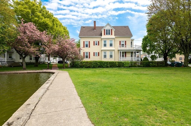 27 Stephen St, Lynn, MA 01902 - view of front of house featuring a chimney and a front lawn