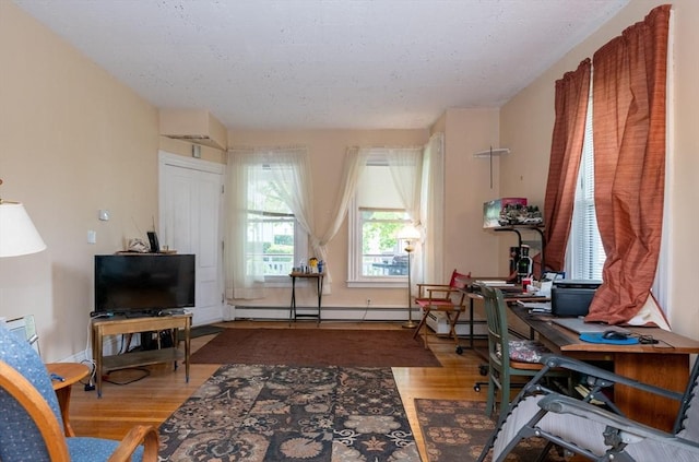 27 Stephen St, Lynn, MA 01902 - office space featuring wood finished floors, baseboard heating, and baseboards