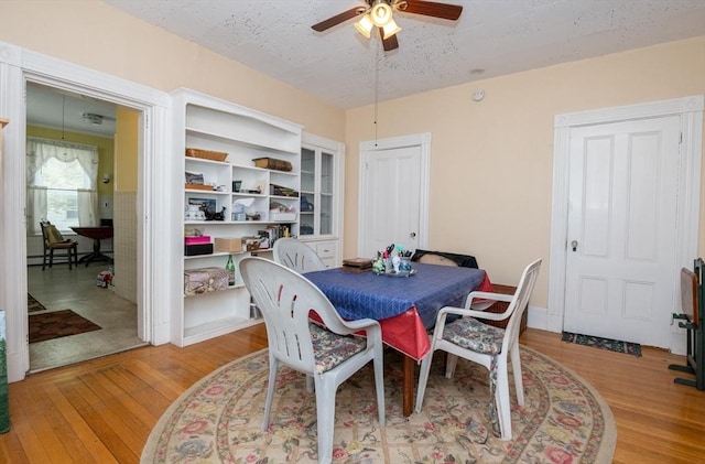 27 Stephen St, Lynn, MA 01902 - dining room featuring a ceiling fan, wood finished floors, and a textured ceiling